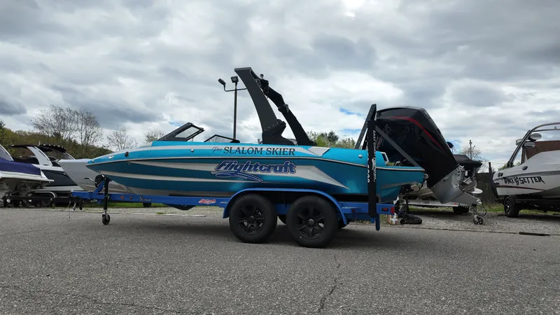 Slide: The Image of 2025 Flightcraft Slalom Skier boat on trailer, cloudy sky. - 5