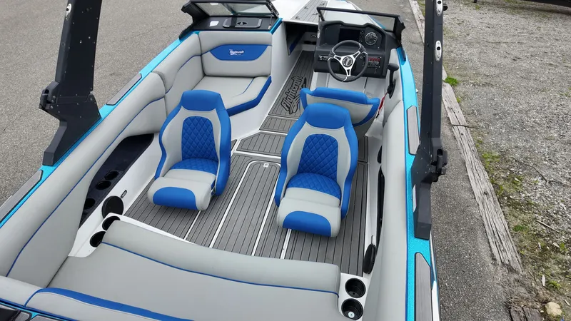 Slide: The Image of Interior of a 2025 Flightcraft Boat with blue and gray seating. - 8