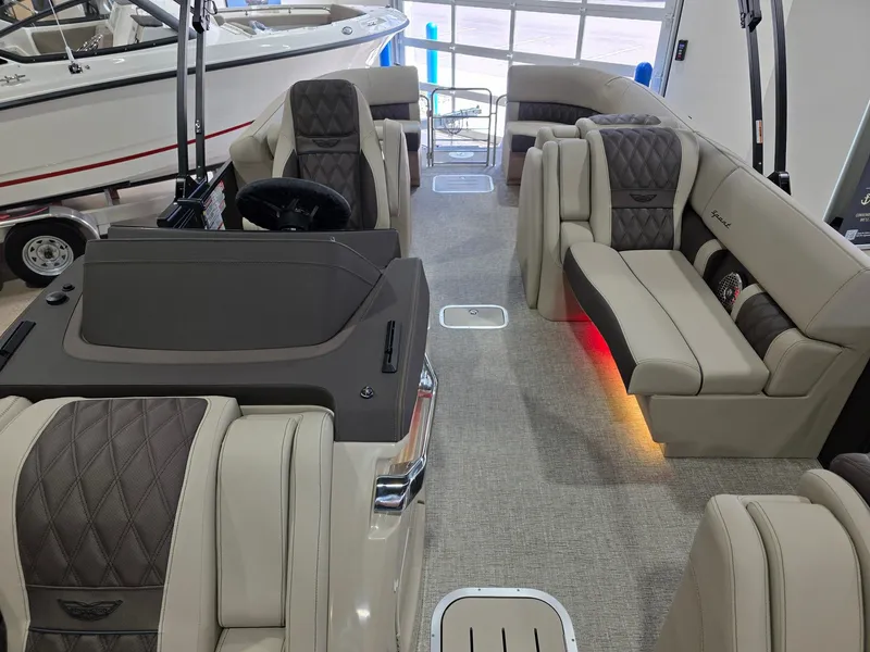 Slide: The Image of Interior of 2026 Bennington 25QFB ESP TRI PB with luxurious seating. - 14