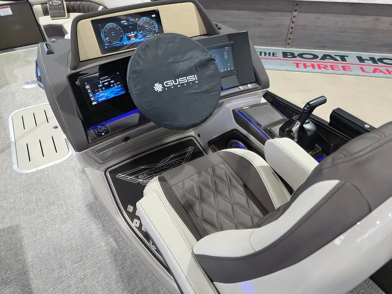 Slide: The Image of Interior of 2026 Bennington 25QFB ESP TRI PB with modern helm console. - 20