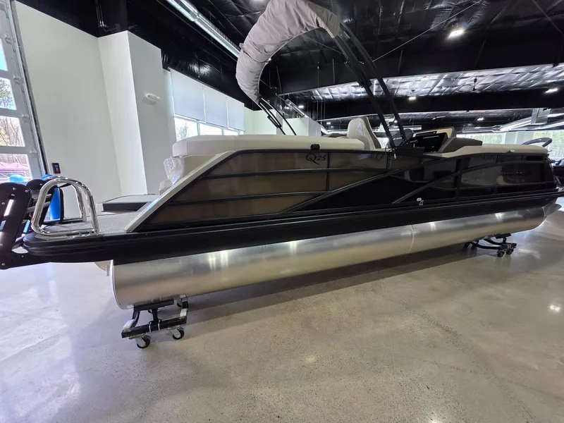 Slide: The Image of 2026 Bennington 25QFB ESP TRI PB pontoon boat in showroom. - 3