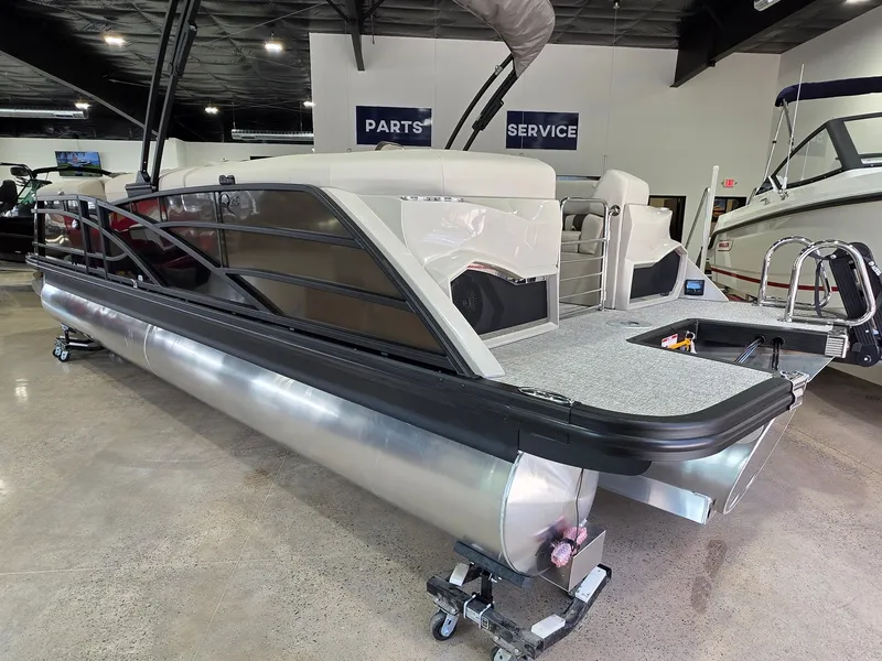 Slide: The Image of 2026 Bennington 25QFB ESP TRI PB pontoon boat in showroom. - 8