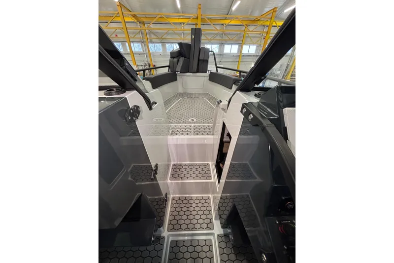 Slide: The Image of Interior view of 2026 XO DFNDR 8 boat with modern design and hexagonal flooring. - 6