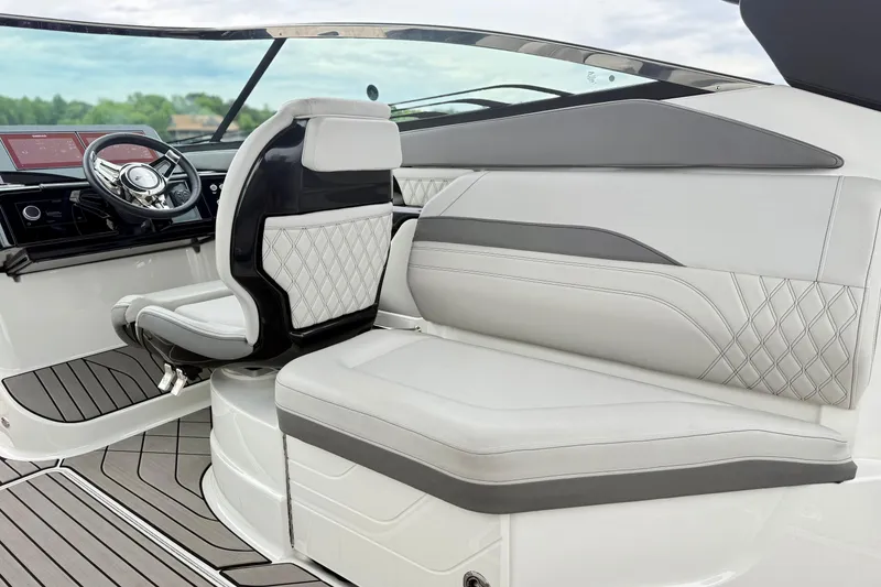 Slide: The Image of 2023 Sea Ray SLX 260 boat interior with luxurious seating and modern dashboard design. - 10