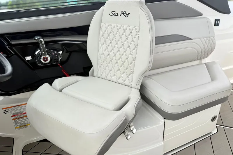 Slide: The Image of 2023 Sea Ray SLX 260 helm seat with luxurious diamond-stitched upholstery and sleek controls. - 11