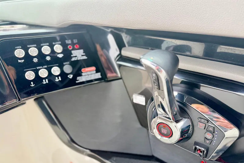 Slide: The Image of Control panel and throttle of 2023 Sea Ray SLX 260 boat. - 15
