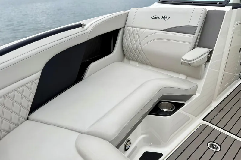 Slide: The Image of Luxurious seating on 2023 Sea Ray SLX 260 boat with elegant upholstery and cup holder. - 20