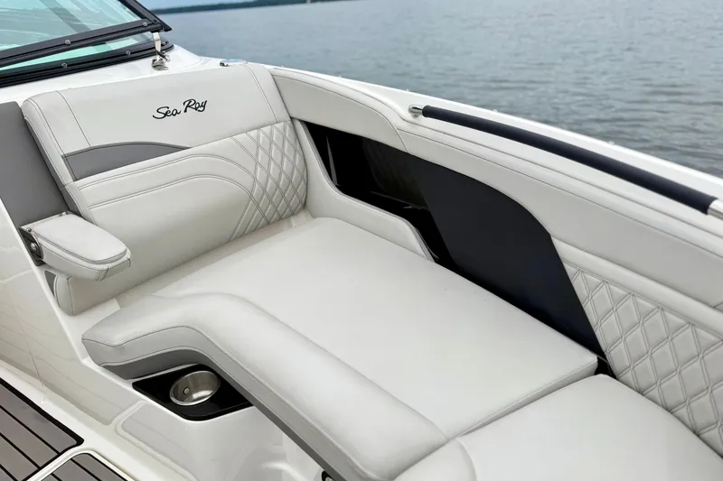 Slide: The Image of Luxurious seating on 2023 Sea Ray SLX 260 boat, featuring elegant white upholstery. - 21