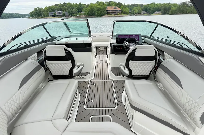 Slide: The Image of Luxurious interior of 2023 Sea Ray SLX 260 boat with elegant seating and modern dashboard. - 8