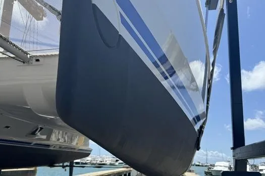Slide: The Image of 2021 Catana 53 catamaran hull in dry dock, showcasing sleek design and modern features. - 12