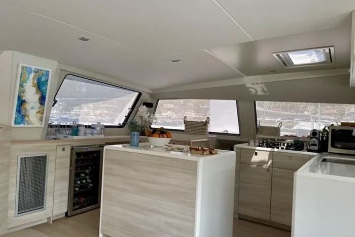 Slide: The Image of Modern kitchen interior of 2021 Catana 53 yacht, featuring sleek design and ample natural light. - 18