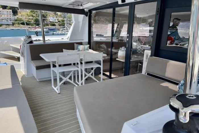 Slide: The Image of Spacious Catana 53 catamaran interior with seating and dining area, 2021 model. - 19
