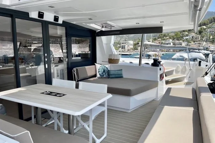 Slide: The Image of Spacious deck of 2021 Catana 53 yacht with seating and dining area. - 20