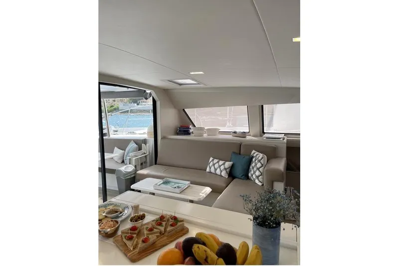Slide: The Image of Luxurious interior of 2021 Catana 53 yacht with elegant seating and snacks. - 22