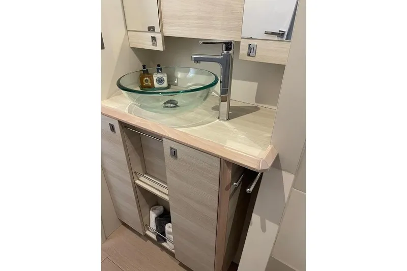 Slide: The Image of Modern bathroom vanity with glass sink on 2021 Catana 53 yacht. - 24