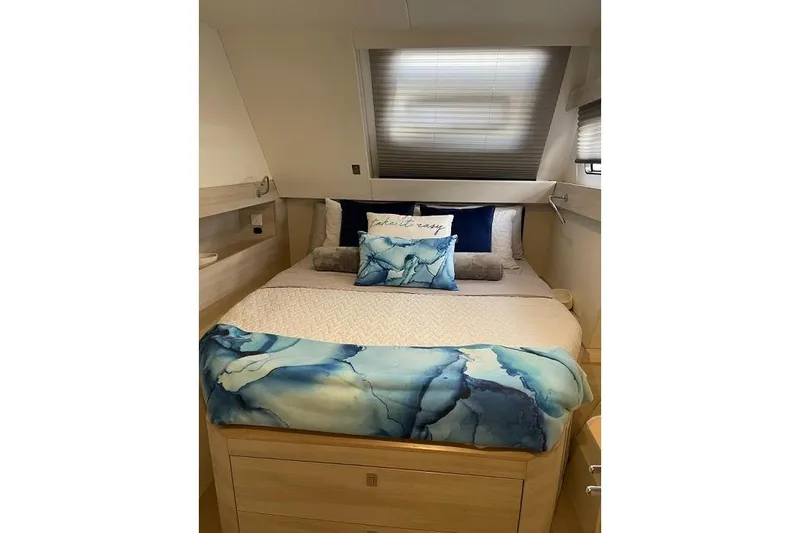Slide: The Image of Luxurious bedroom interior of 2021 Catana 53 yacht with elegant bedding and modern design. - 25