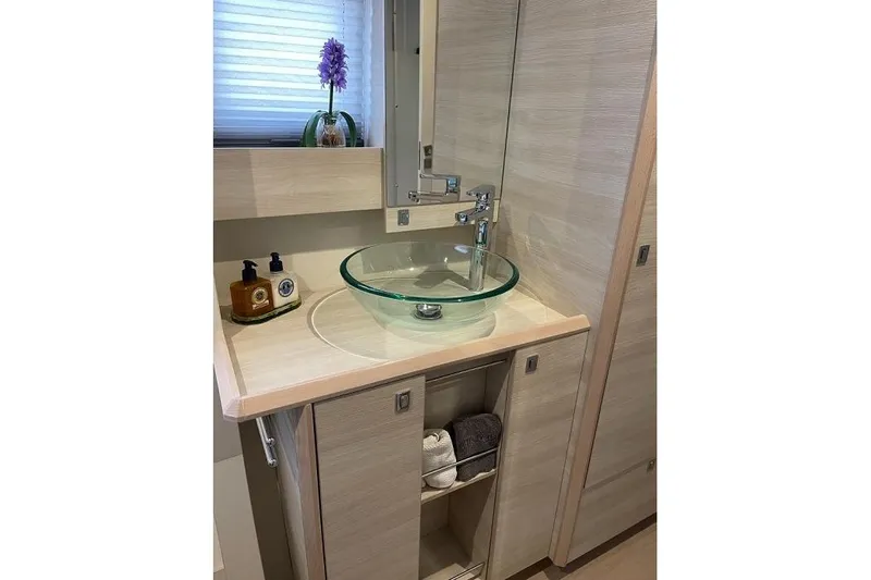 Slide: The Image of Modern bathroom vanity with glass sink on Catana 53 yacht, 2021 model. - 28