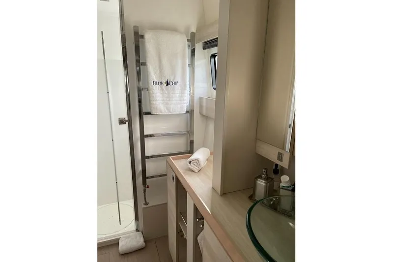 Slide: The Image of Luxurious bathroom in 2021 Catana 53 yacht with modern fixtures and elegant design. - 30
