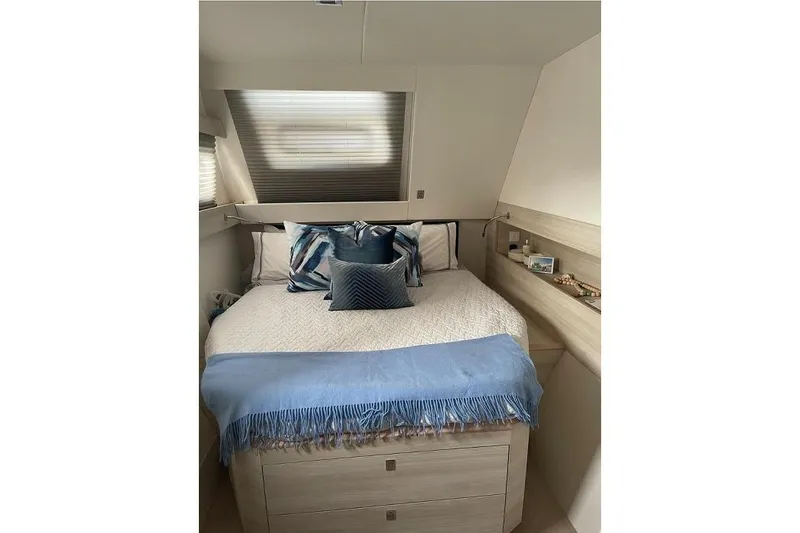 Slide: The Image of Cozy bedroom interior on 2021 Catana 53 yacht with blue accents and modern design. - 32