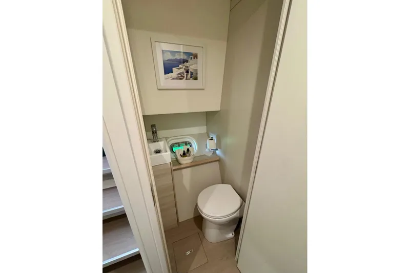 Slide: The Image of Compact bathroom in 2021 Catana 53 yacht, featuring modern fixtures and minimalist design. - 41