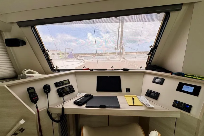 Slide: The Image of Interior view of a 2021 Catana 53 yacht's navigation station with modern equipment. - 46