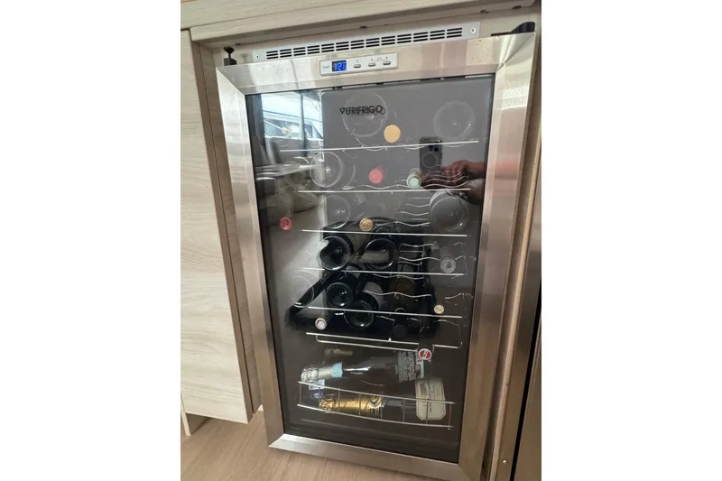 Slide: The Image of Wine cooler on a 2021 Catana 53 yacht, stocked with assorted bottles. - 47