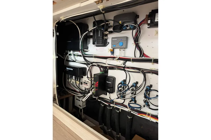 Slide: The Image of Electrical panel of a 2021 Catana 53 yacht, showcasing complex wiring and equipment. - 53