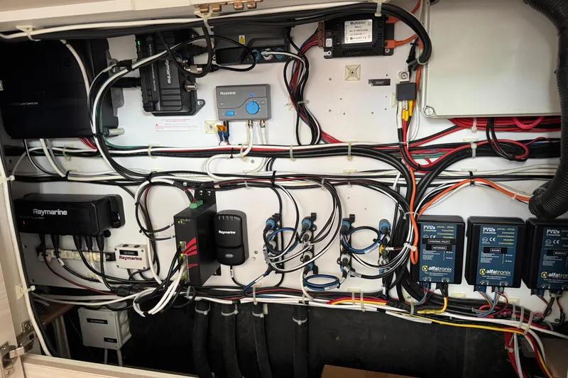 Slide: The Image of Electrical panel of a 2021 Catana 53 yacht, featuring Raymarine and Alfatronix components. - 54
