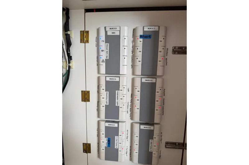 Slide: The Image of Electrical panel on a 2021 Catana 53 yacht, featuring labeled circuit breakers. - 55