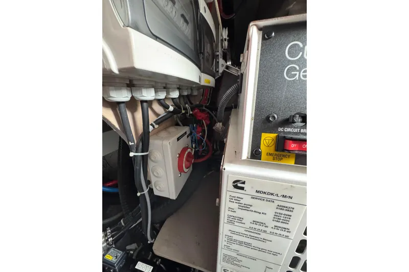 Slide: The Image of Engine compartment of a 2021 Catana 53, featuring electrical components and wiring. - 63