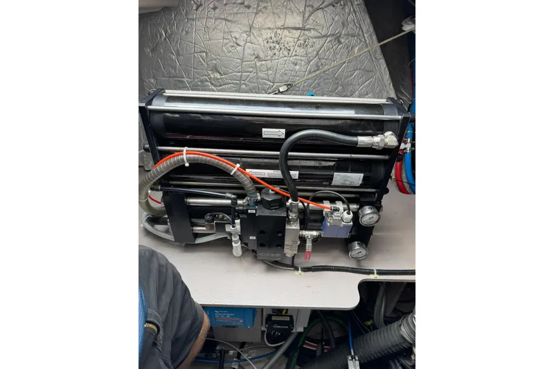 Slide: The Image of Engine room of a 2021 Catana 53 yacht, showcasing mechanical components and piping. - 66