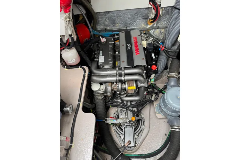 Slide: The Image of Engine compartment of a 2021 Catana 53 yacht featuring a Yanmar engine. - 67