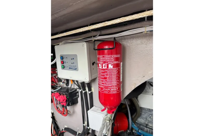 Slide: The Image of Fire extinguisher and control panel in 2021 Catana 53 yacht engine room. - 70
