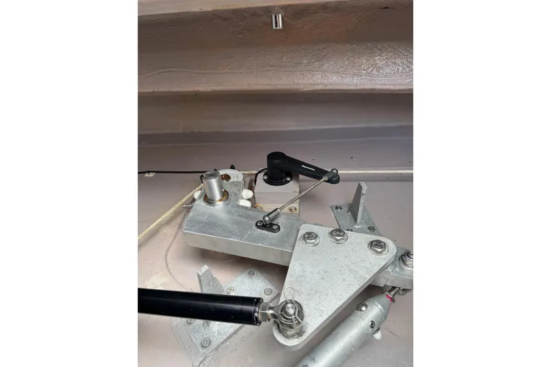 Slide: The Image of Mechanical component of a 2021 Catana 53 yacht, featuring metal levers and cables. - 72