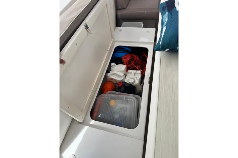 Slide: The Image of Storage compartment on a 2021 Catana 53 yacht, containing various supplies and equipment. - 75