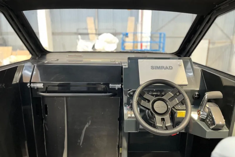 Slide: The Image of Interior cockpit of 2026 XO DFNDR A8 boat with Simrad navigation system. - 12