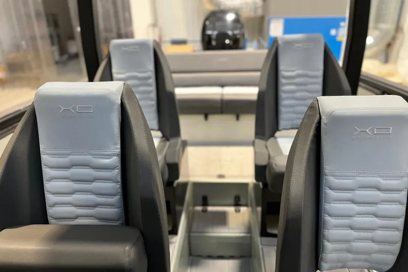 Slide: The Image of Interior of 2026 XO DFNDR A8 boat with modern seating design. - 14