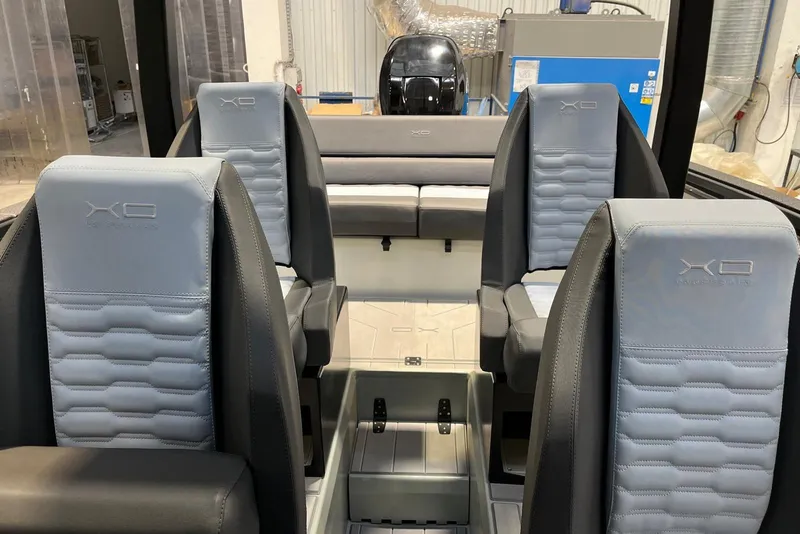 Slide: The Image of Interior of 2026 XO DFNDR A8 boat with modern seating and sleek design. - 15