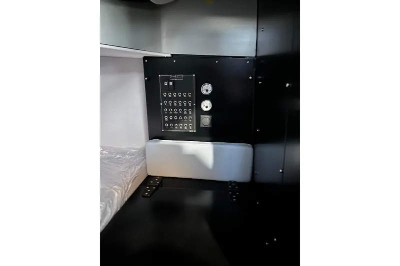 Slide: The Image of Control panel inside 2026 XO DFNDR A8, featuring gauges and switches. - 19