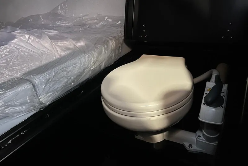 Slide: The Image of Compact bathroom with toilet and bed in 2026 XO DFNDR A8 model. - 21