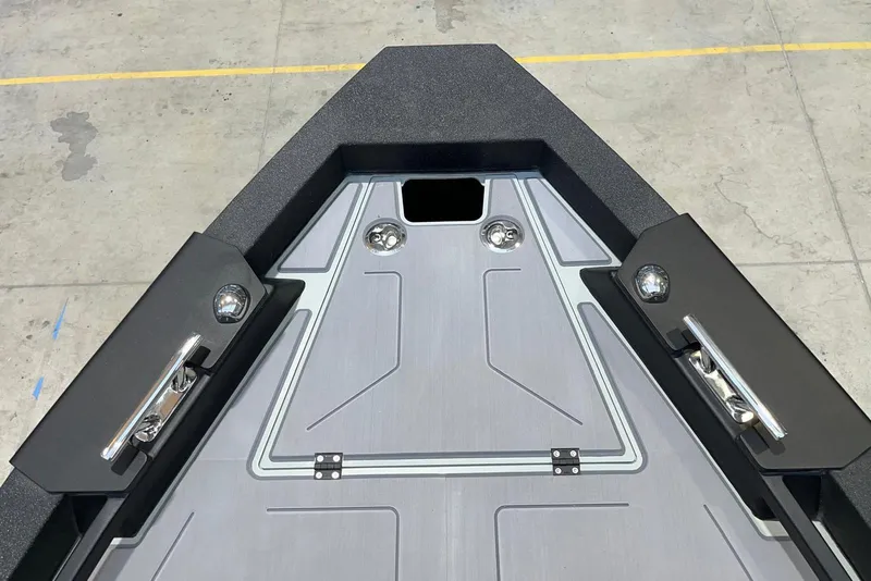Slide: The Image of Bow view of 2026 XO DFNDR A8 boat with sleek design and modern fittings. - 26