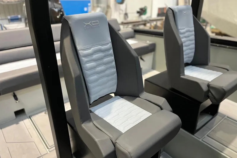 Slide: The Image of Modern XO DFNDR A8 2026 boat seats with sleek gray and white design. - 31