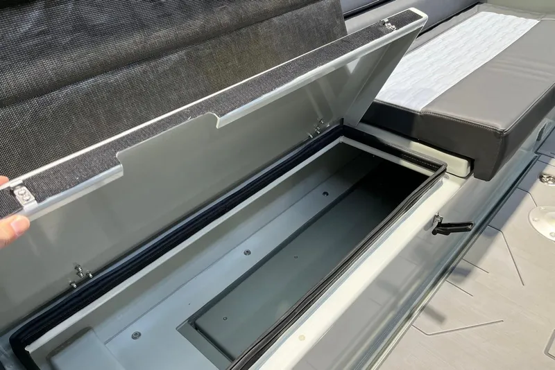 Slide: The Image of Storage compartment on the 2026 XO DFNDR A8 boat, showcasing sleek design and functionality. - 33