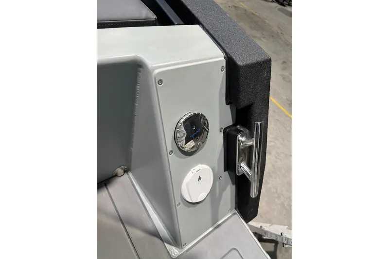 Slide: The Image of Control panel of 2026 XO DFNDR A8 boat with handle and dials. - 36