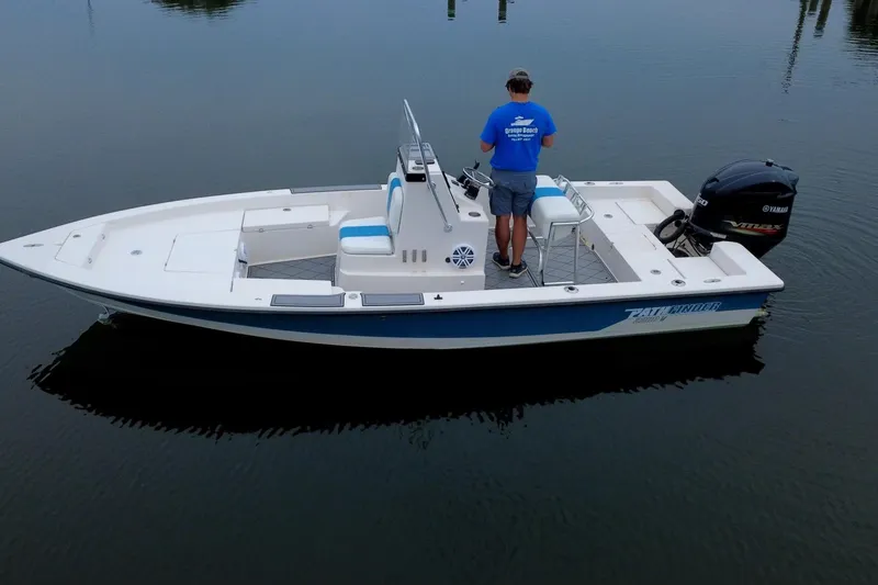 The Image of 2004 Pathfinder 2200 V boat on calm water, featuring Yamaha outboard motor. - 1
