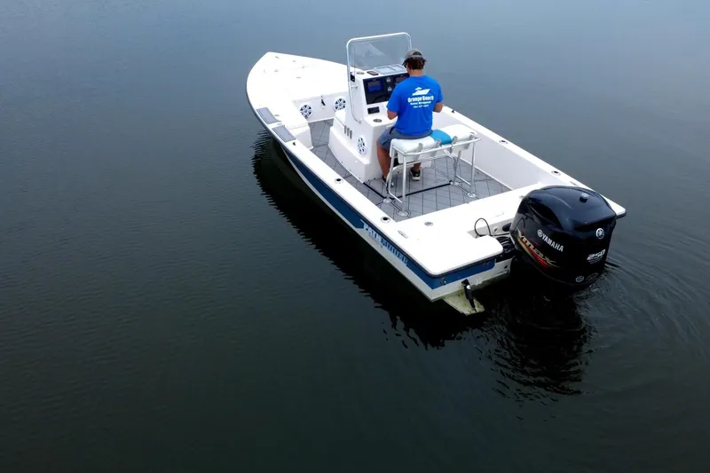Slide: The Image of 2004 Pathfinder 2200 V boat on calm water, featuring Yamaha outboard motor. - 8