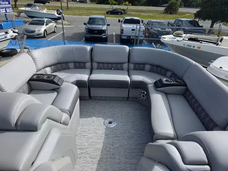 Slide: The Image of Interior of a 2020 Bennington 25QXFB pontoon boat with gray leather seating. - 10