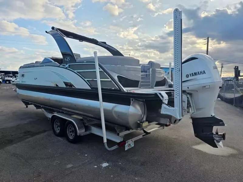 Slide: The Image of 2020 Bennington 25QXFB pontoon boat with Yamaha engine on trailer. - 4