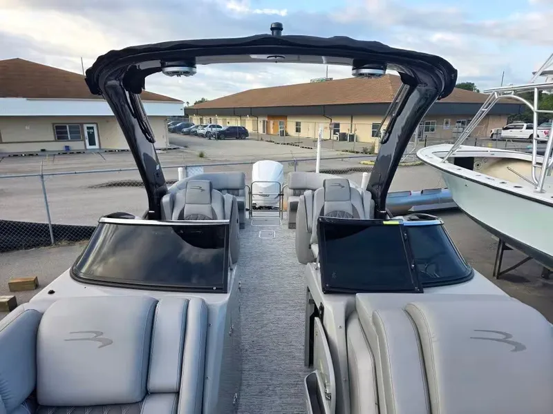 Slide: The Image of 2020 Bennington 25QXFB pontoon boat with luxurious interior at the dock. - 7