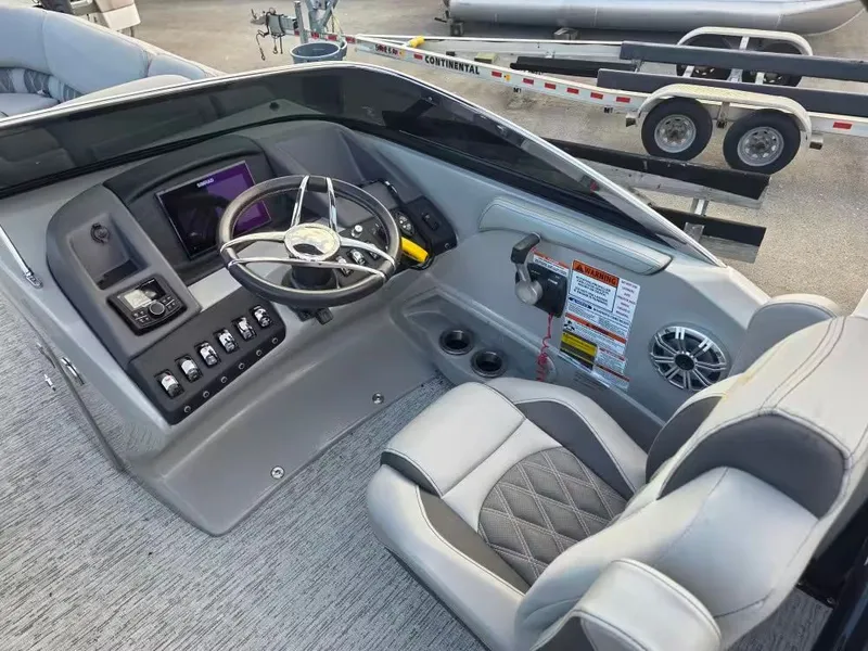 Slide: The Image of Interior of 2020 Bennington 25QXFB with steering console and seat. - 9